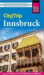 "City|Trip Innsbruck" von Sven Eisermann. Ein historisches Gebäude mit verziertem Balkon und goldfarbenem Dach.