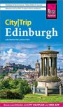 #Highlights für Nachtschwärmer | City|Trip Edinburgh. Blick auf ein Monument mit der Altstadt im Hintergrund.