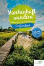 "Märchenhaft wandern: Unterwegs zu sagenhaften Orten in Ostfriesland." Holzsteg über Schilf in einer grünen Landschaft.