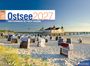 Text: "Ostsee 2027 von Flensburg bis nach Usedom." Strandkörbe am Sandstrand, ein Pier mit Gebäude im Hintergrund.