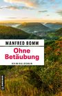 "Manfred Bomm, Ohne Betäubung, Kriminalroman." Landschaft mit Hügeln, Wald und einem Dorf im Tal bei Sonnenuntergang.