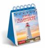 Text: "Ein Jahr der Zuversicht" und "2027". Kalender mit einem Leuchtturm bei Sonnenuntergang, spiralförmig gebunden.