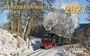 „DAMPFBAHN-ROUTE Sachsen 2027“. Winterlandschaft mit dampfender Lokomotive auf schneebedeckter Strecke. 