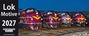 Links Text: "Lok Motive 2027", darunter "Eisenbahn Kurier". Rechts vier rot-braune Lokomotiven mit gelbem Logo.