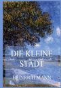 Text: "DIE KLEINE STADT" und "HEINRICH MANN". Im Hintergrund eine impressionistische Landschaft mit Bäumen und Fluss.