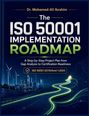 Text: "Dr. Mohamed-Ali Ibrahim - The ISO 50001 Implementation Roadmap - A Step-by-Step Project Plan... ISO 50001:2018/Amd 1:2024." 
Illustration: Windturbinen, Stadtansicht, leuchtender Pfad.