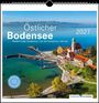 "Östlicher Bodensee 2027. Eastern Lake Constance. Foto eines Hafens mit Kirche und bunten Häusern am Wasser."