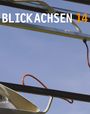 Text "Blickachsen 14" in Weiß und Orange, darüber Metallkonstruktion und Kabel vor blauem Himmel.
