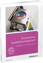 Aufschrift: "Grundwissen Qualitätsmanagement." Lila Cover mit einem Vergrößerungsglas auf farbigem Hintergrund.