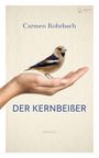 Texte: Carmen Rohrbach, DER KERNBEIßER, Roman. Eine Hand hält einen Kernbeißer-Vogel.