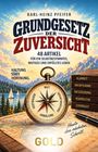 „Grundgesetz der Zuversicht“ zeigt einen Kompass, Berge, Wasser, Bücher und den Schriftzug „Heute den nächsten Schritt.“