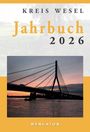 Text: "Kreis Wesel Jahrbuch 2026" und "MERCATOR". Foto einer Brücke im Abendlicht.