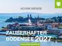 Text: ACHIM MENDE, ZAUBERHAFTER BODENSEE 2027, www.oertel-spoerer.de. 

Beschreibung: Landschaft mit Bodensee, Stadt im Vordergrund.