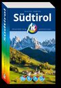 "Südtirol" von Florian und Sibylle Fritz. Michael Müller Verlag, authentisch reisen. Landschaft mit Dorf und Bergen im Hintergrund.