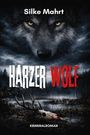 „Silke Mahrt, HARZER WOLF, Kriminalroman“ steht über das Gesicht eines Wolfes, in einem düsteren Wald über einem Totenschädel.