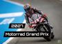 2027 Motorrad Grand Prix, Rennfahrer auf schwarzem Motorrad in Kurve, dynamische Szene.