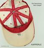 Die Sammlung Gerri Geiger. Eine rote und beige Kappe, oben die Zahl "15". Text auf rotem Streifen: "Sutterheim".