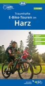"Traumhafte E-Bike-Touren im Harz." Zwei Menschen fahren auf E-Bikes durch einen Waldweg bei sonnigem Wetter.