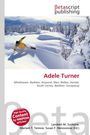Betascript Publishing. Adele Turner. Wintersportler fährt durch tiefen Schnee, umgeben von schneebedeckten Bäumen.