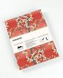 „HIROSHIGE“ ist auf einer Verpackung für Geschenk- und Kreativpapier abgebildet, verziert mit Kirschblüten auf rotem Hintergrund.