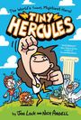 "THE WORLD’S TINIEST, MIGHTIEST HERO! Tiny Hercules" in großen Buchstaben. Illustration: Kind mit Löwenfell, Säule, Adler.