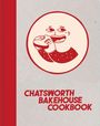 "Chatsworth Bakehouse Cookbook". Eine Illustration zeigt eine lachende Figur, die ein großes Sandwich isst.