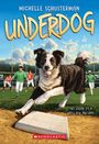 Text: "MICHELLE SCHUSTERMAN UNDERDOG. THIS SEASON IT'S A WHOLE NEW PAW GAME!" Illustration: Ein Hund rennt auf ein Baseballfeld.