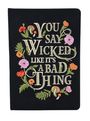 „YOU SAY WICKED LIKE IT'S A BAD THING“ in gestickter Schrift mit bunten Blumen und Blättern verziert.