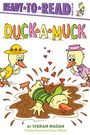 Oben steht "READY TO READ". Darunter "DUCK-A-MUCK". Zwei Enten schauen eine lachende Ente im Schlamm an.