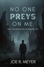 "No one preys on me. What it takes from you when you refuse to be prey. Joe R. Meyer." Eine düstere Szenarie mit einer Silhouette vor Ruinen.
