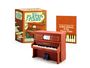 "Mini Player Piano", "With Sound & Moving Keys!", "Let the Good Times Roll: A Mini History of the Player Piano". Mini-Piano, Verpackung.